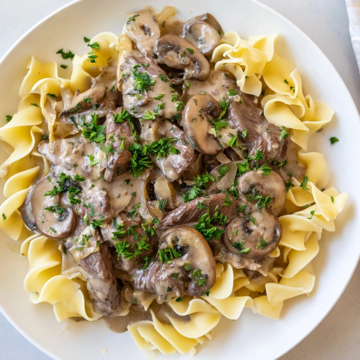 Rich, homemade beef stroganoff with mushrooms, perfect comfort food, looks and smells delicious.