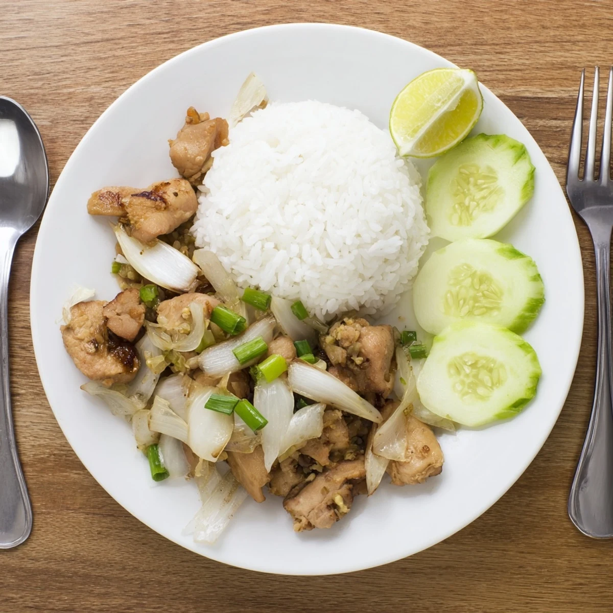 Close-up of tender Vietnamese Lemongrass Chicken pieces coated in a glossy, aromatic sauce.