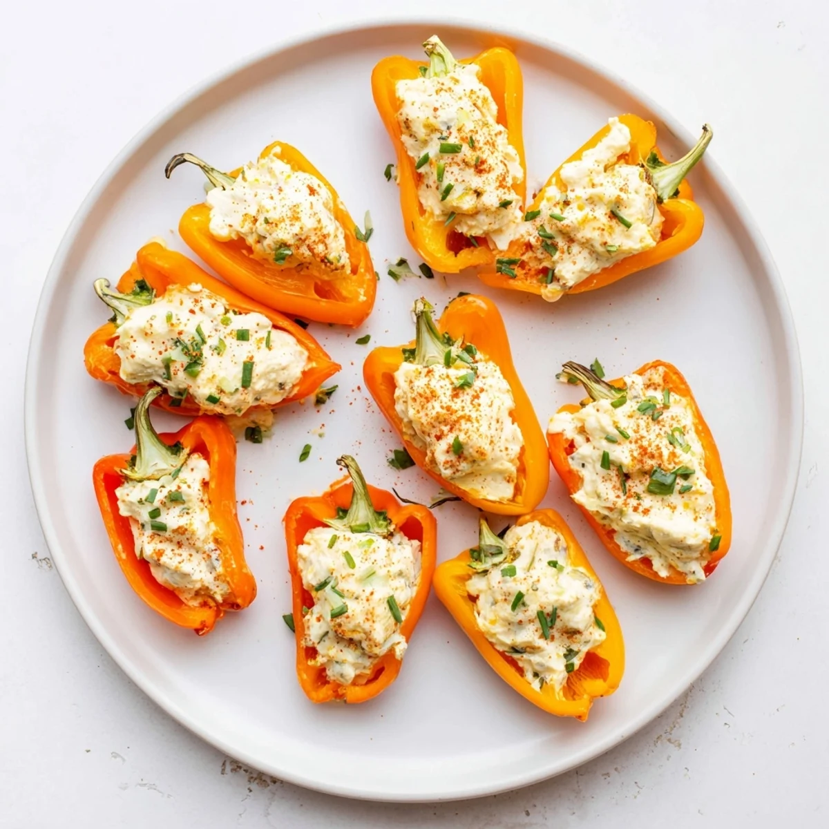 Colorful roasted mini peppers filled with creamy three-cheese blend, perfectly air fried until tender and lightly golden