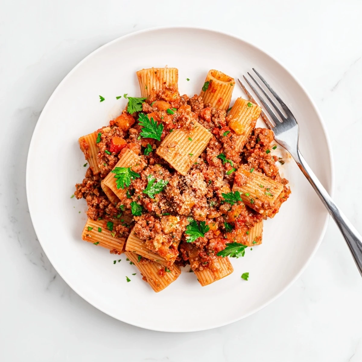 Rich and hearty Turkey Bolognese topped with freshly grated Parmesan cheese and chopped parsley